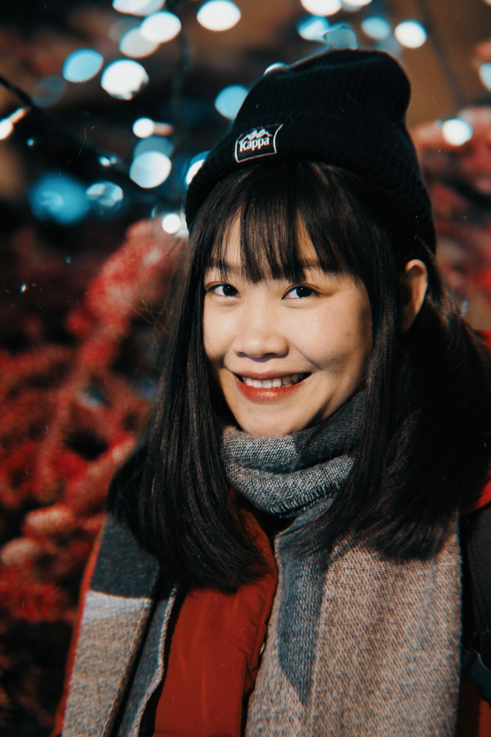 a woman wearing a black hat and scarf