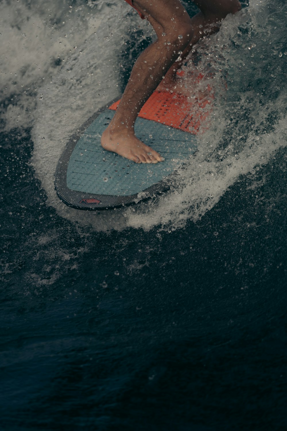 a person riding a surf board on a wave