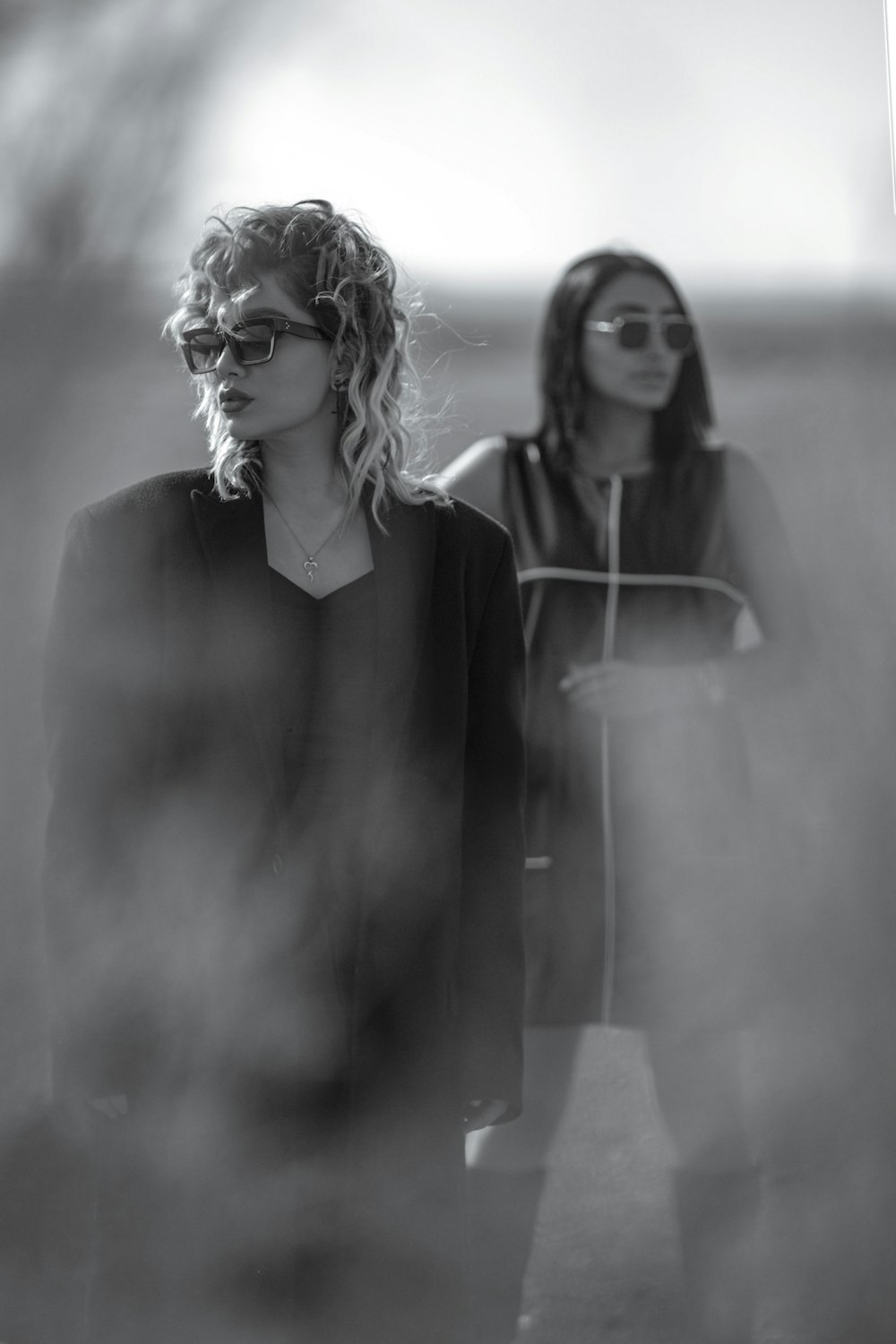 a black and white photo of two women