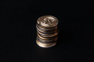 Close-up of game currency icons glowing with golden light on dark background
