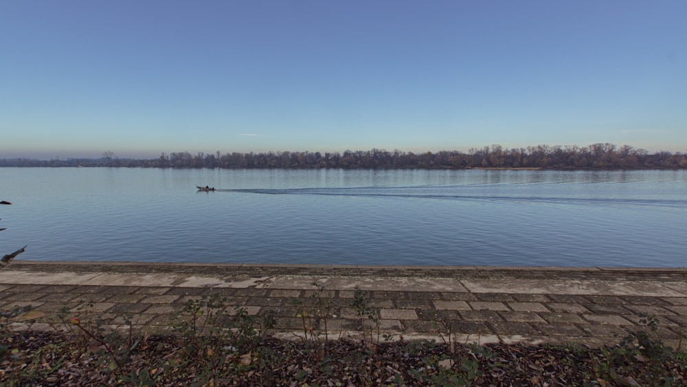 a boat traveling across a large body of water