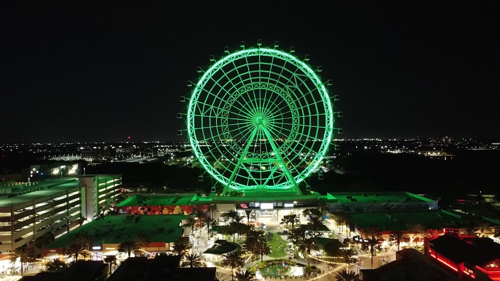 a large ferris wheel lit up at night