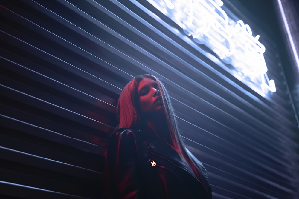 a woman standing in front of a building