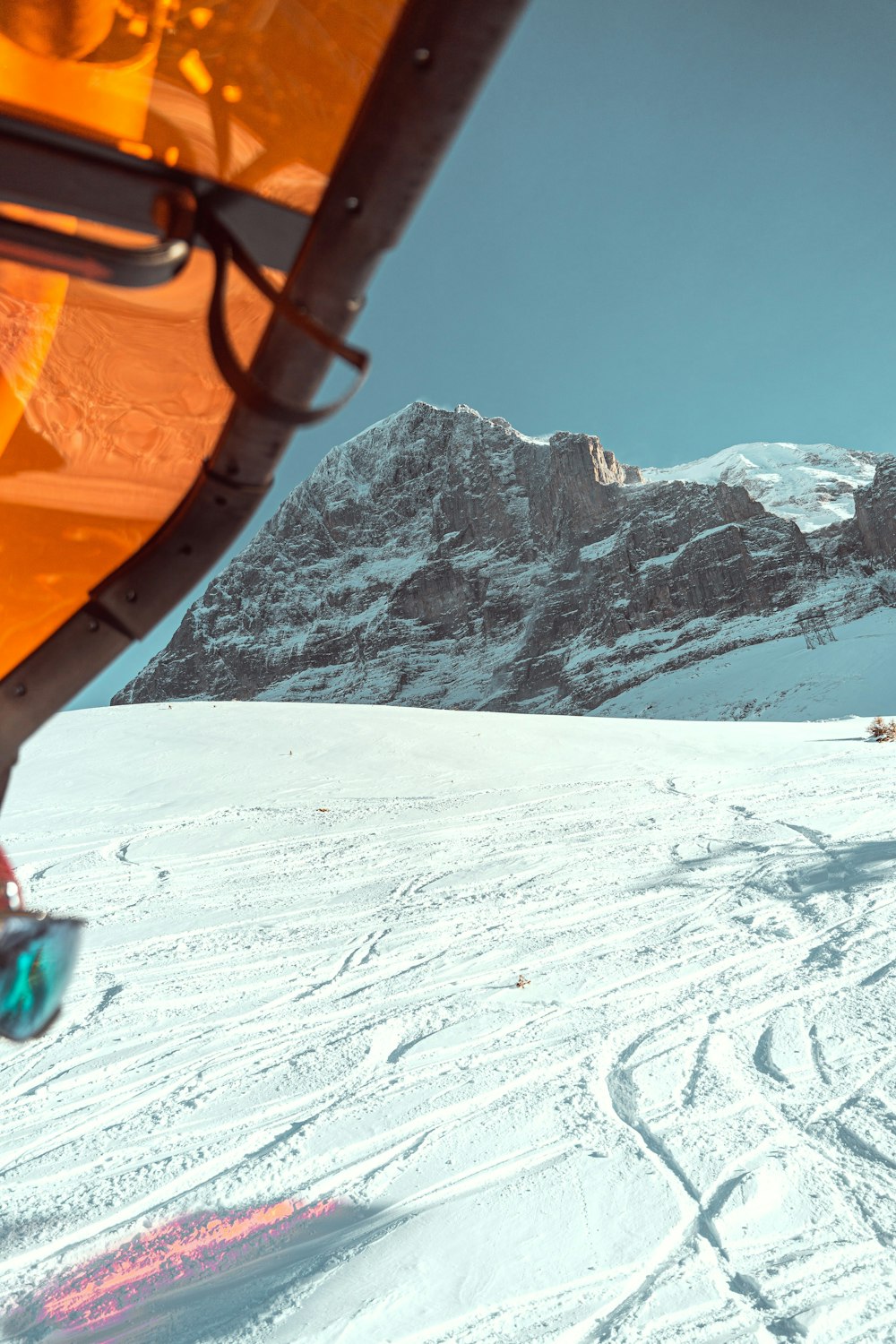 a man riding skis on top of a snow covered slope