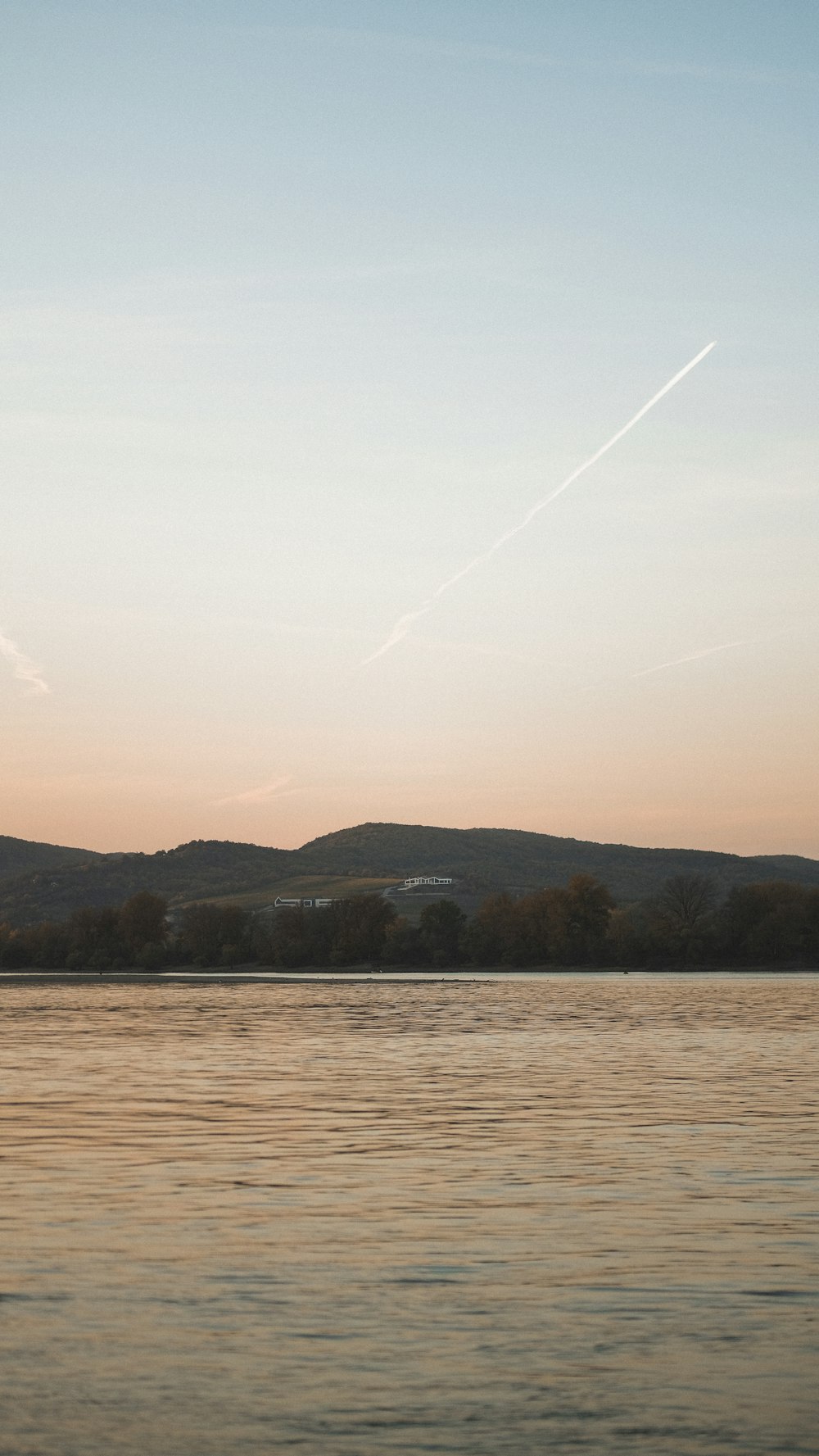 a plane flying over a body of water