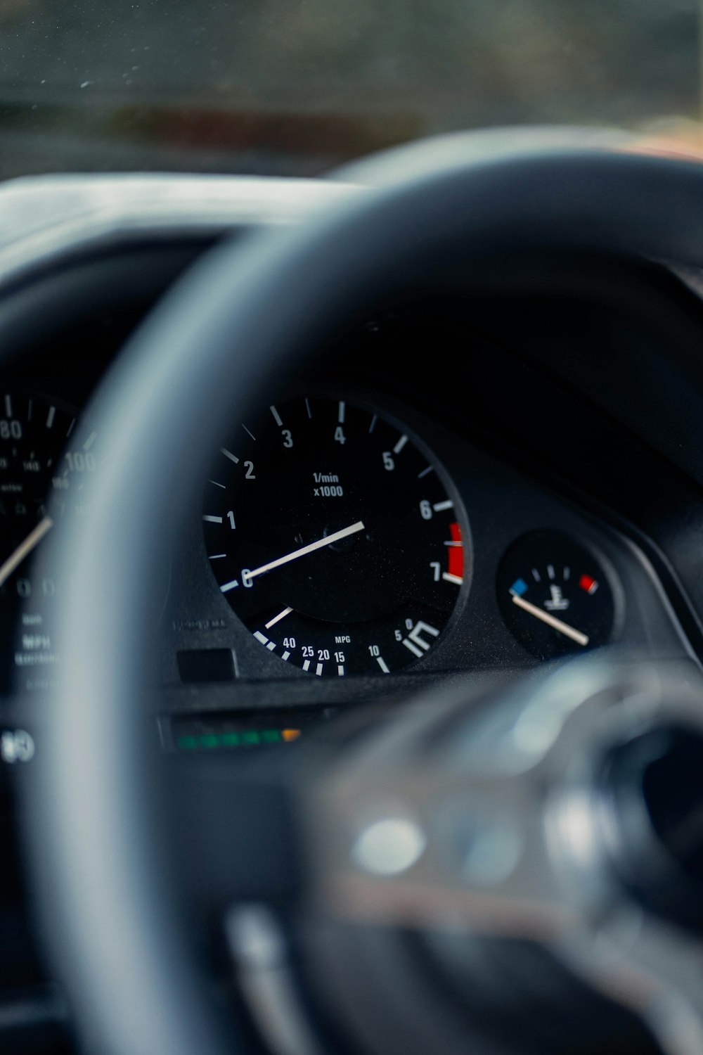 a close up of a steering wheel and dashboard of a car