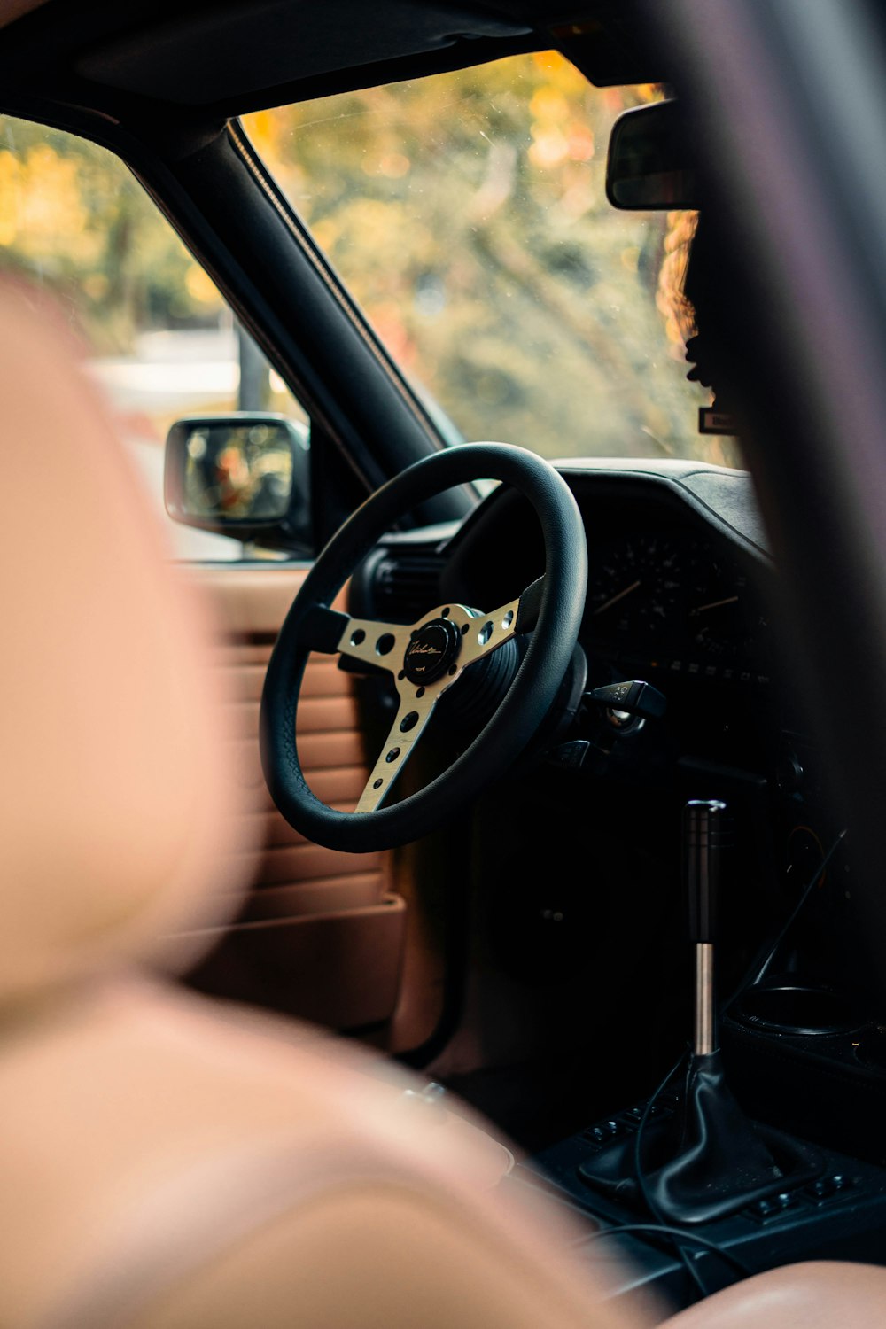 the interior of a car with a steering wheel