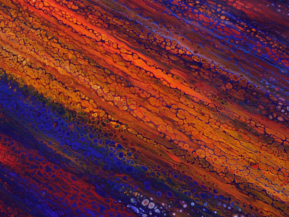 a painting of a multicolored background with drops of water
