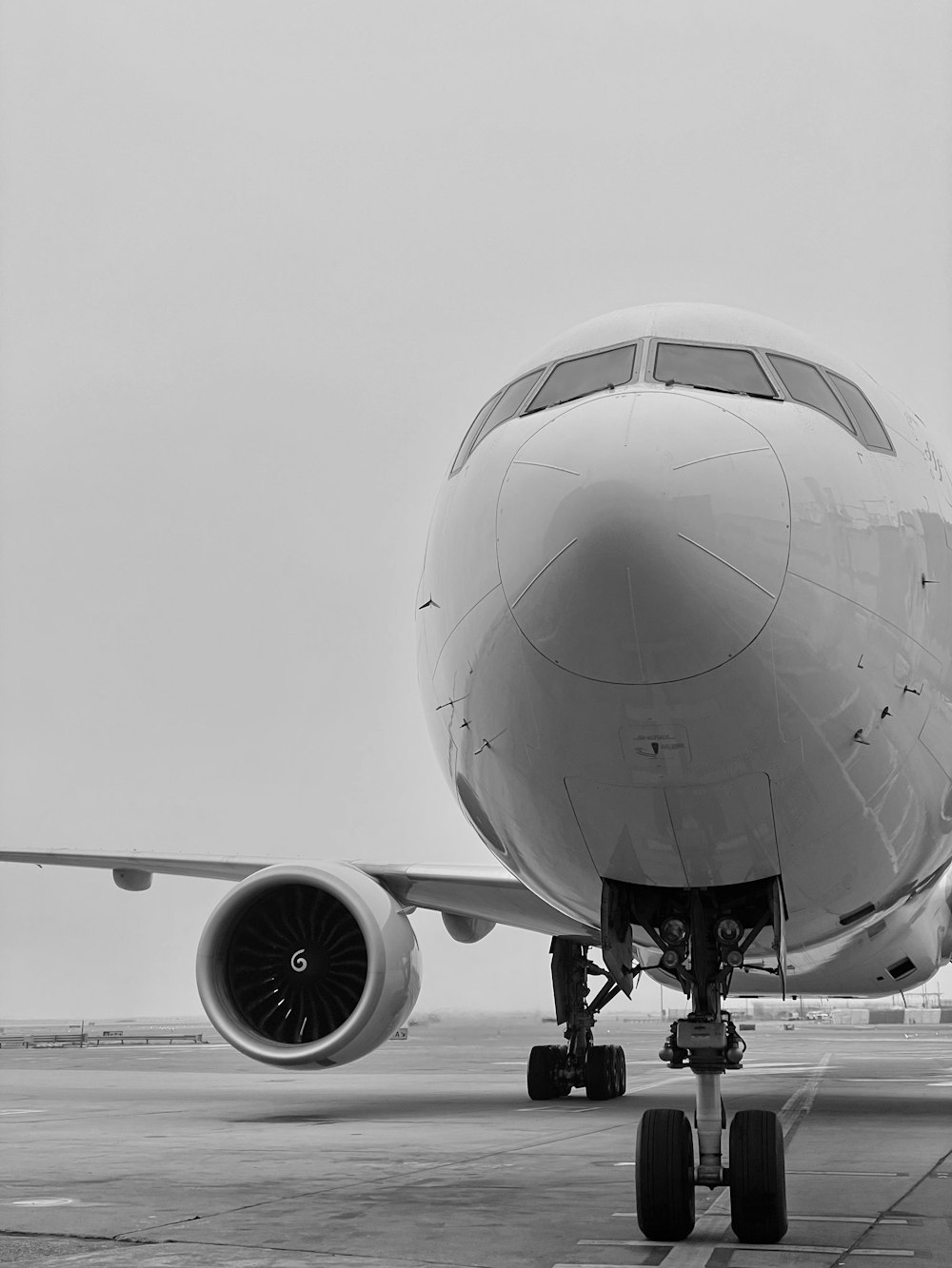 a large jetliner sitting on top of an airport tarmac