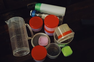 a table topped with plastic containers and containers