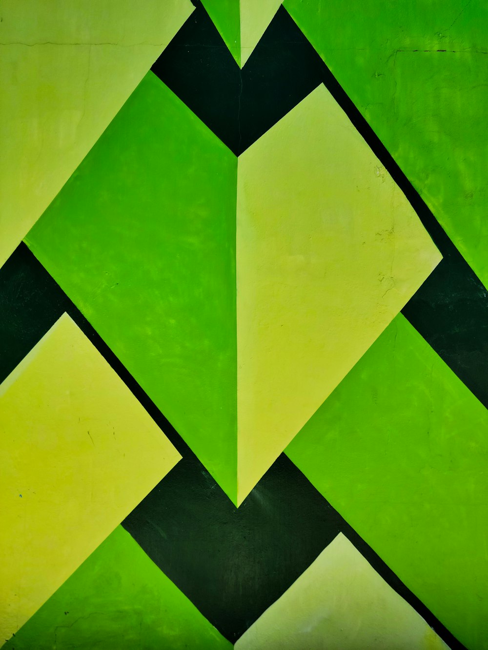 a painting of a green and yellow geometric design