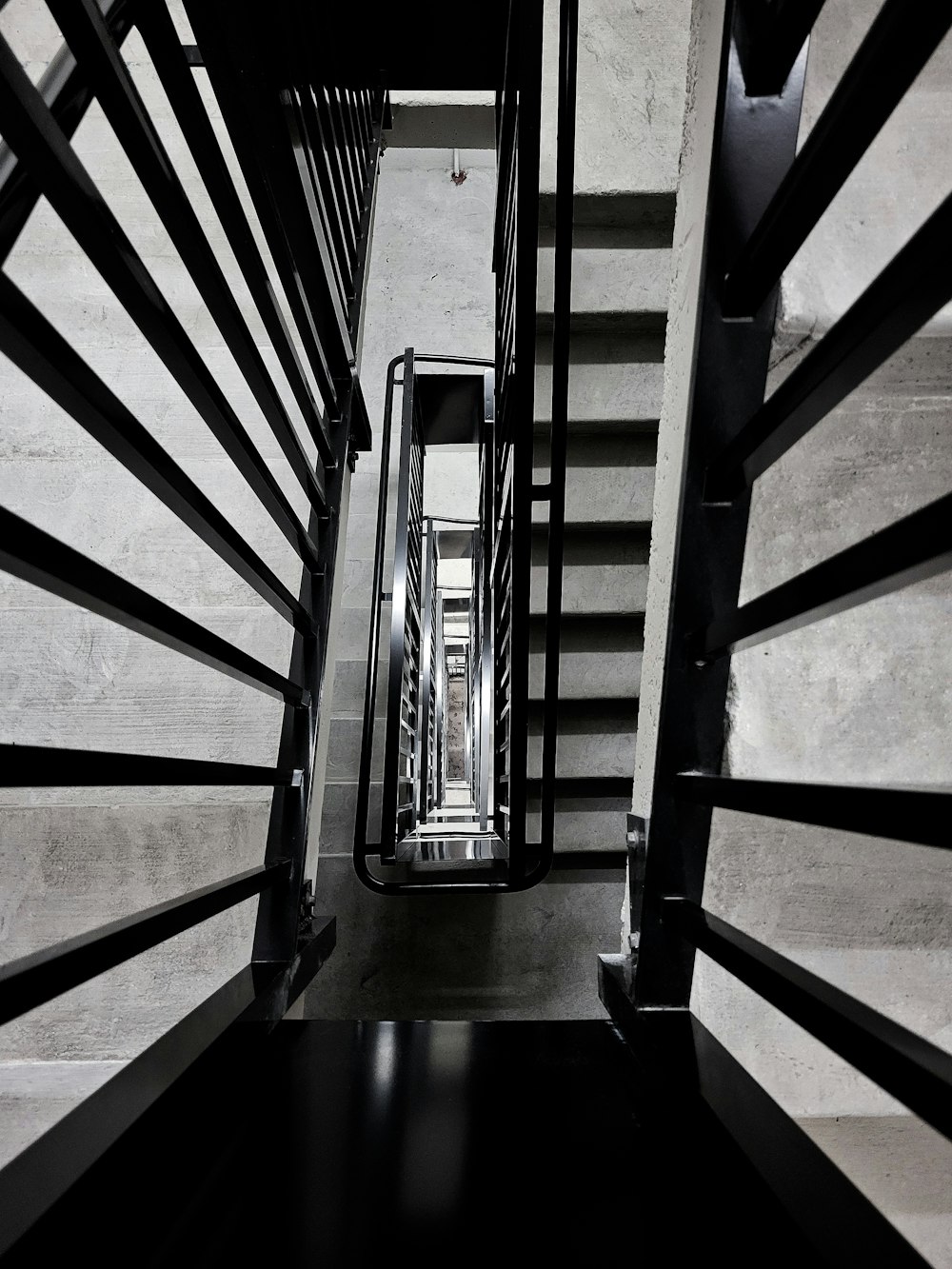 a black and white photo of a staircase