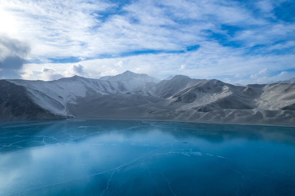 a large body of water surrounded by mountains