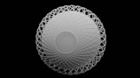 a white circular object with a black background