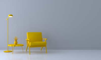 a yellow chair and a yellow table in a room
