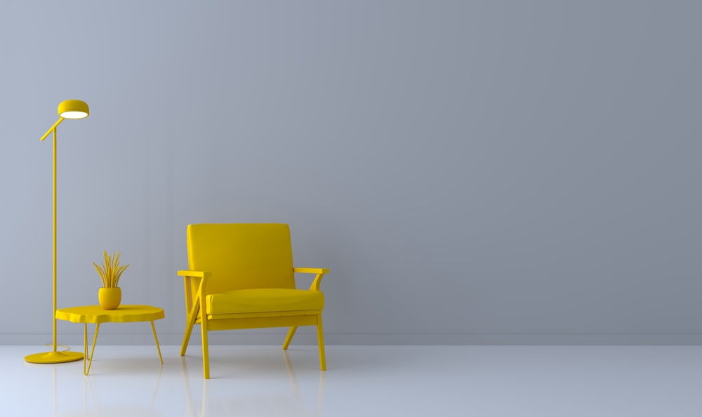 a yellow chair and a yellow table in a room