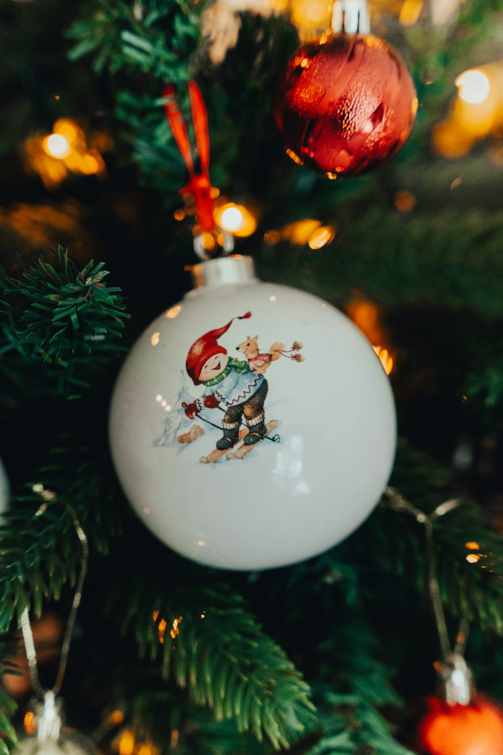 a christmas ornament hanging from a christmas tree