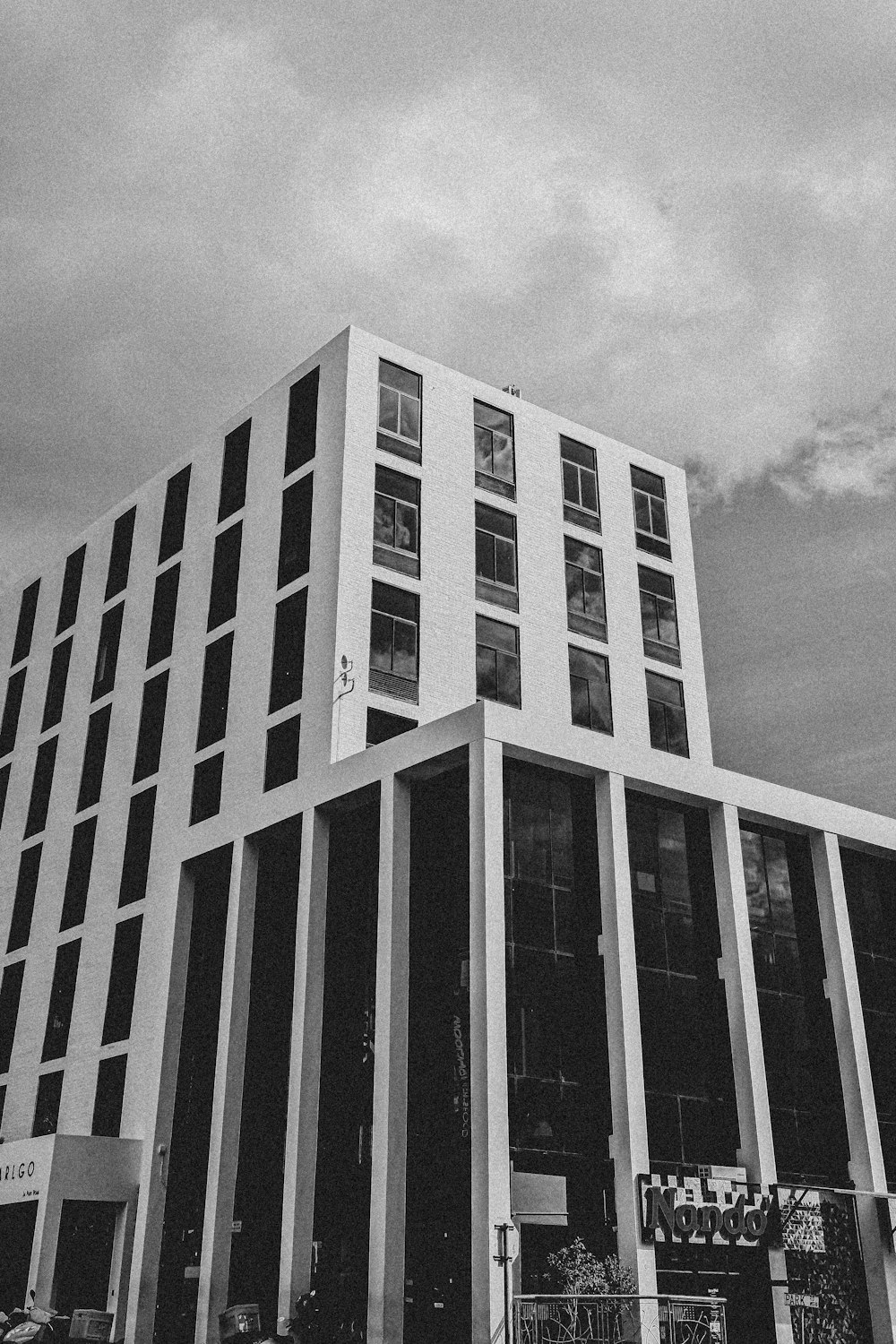 a black and white photo of a tall building