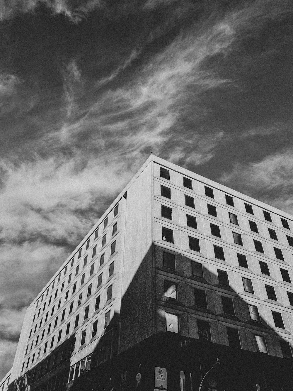 a black and white photo of a tall building