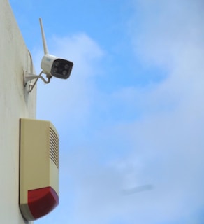 a security camera attached to the side of a building