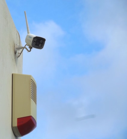 a security camera attached to the side of a building