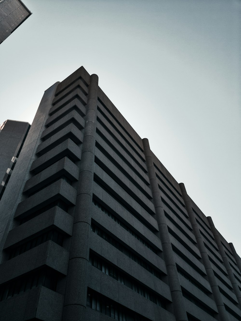 a very tall building with a sky in the background