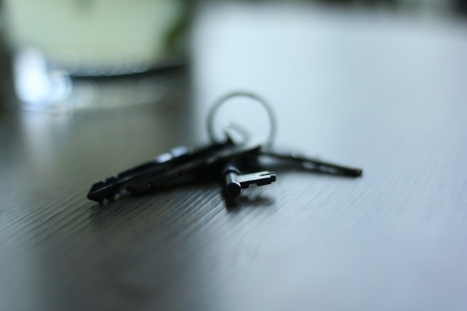 House keys resting on a signed purchase agreement, representing a Clark County home sale that closed at the right price