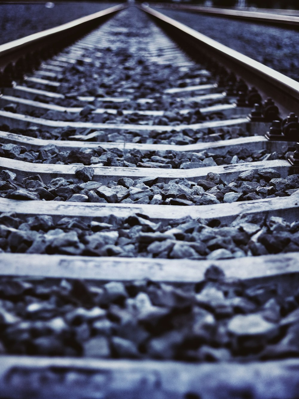 a close up of a train track with rocks