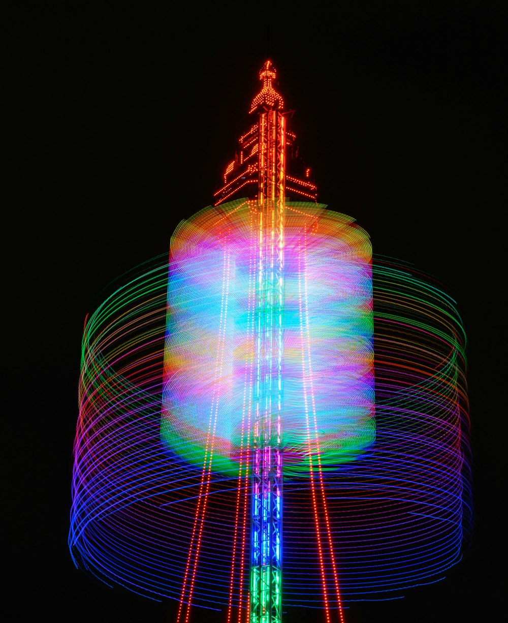 a brightly lit merry go round at night