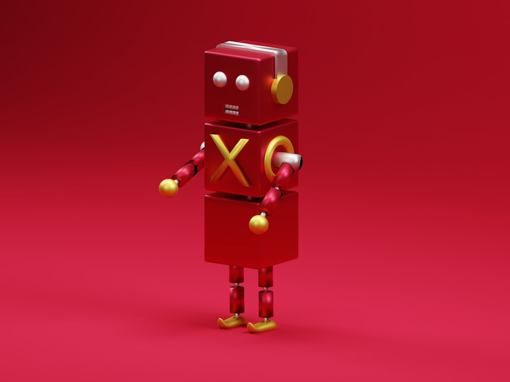 a red robot is standing on a pink background