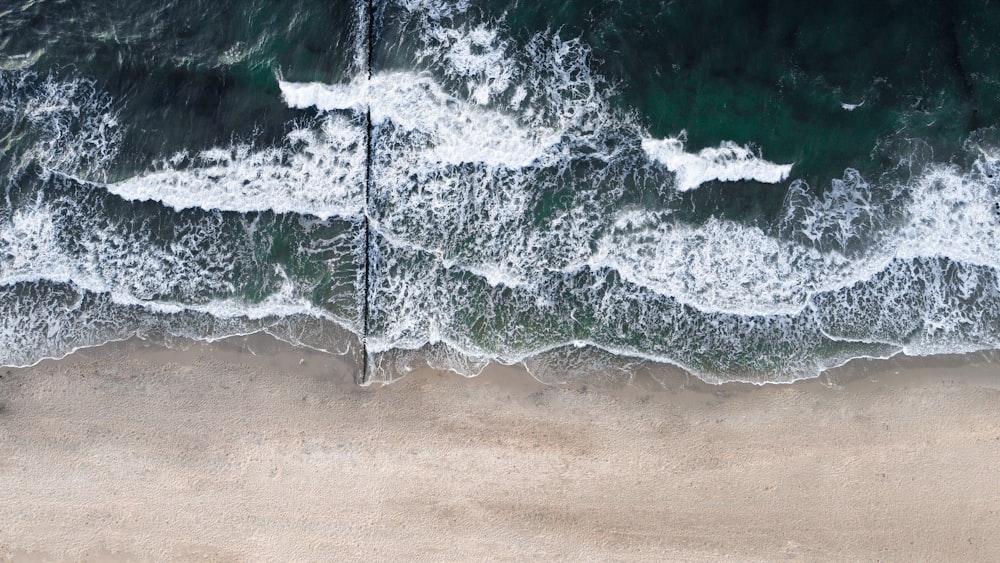 an aerial view of a beach and ocean