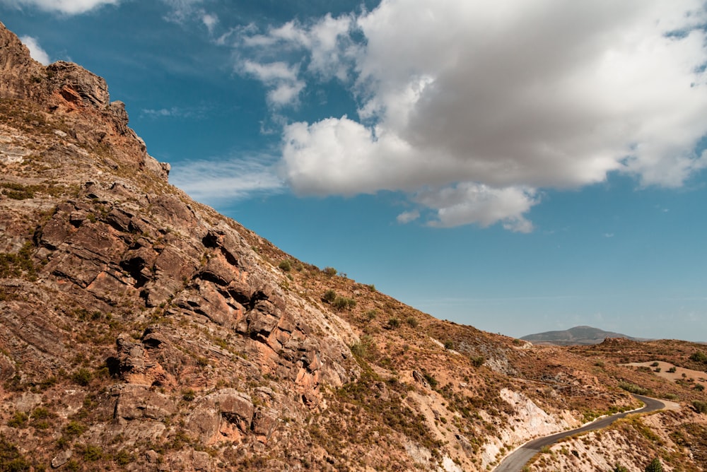 a mountain with a road going up the side of it