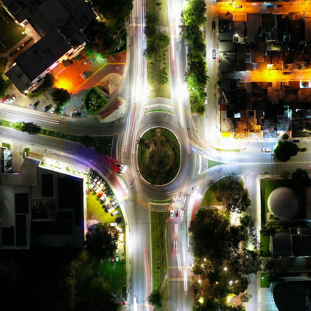 an aerial view of a city intersection at night