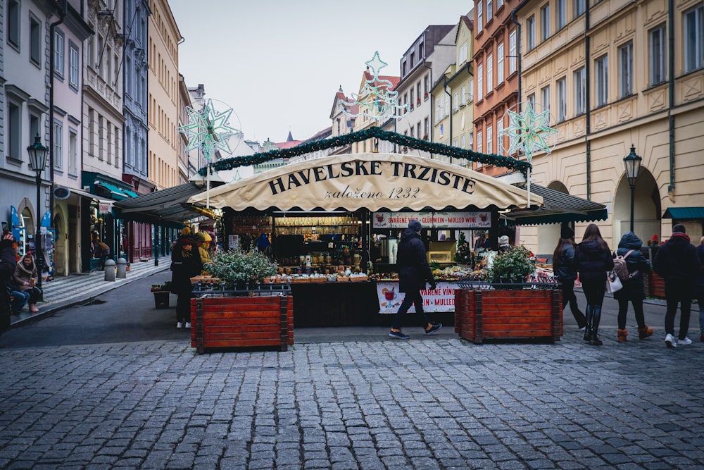 a small market stand on a cobblestone street