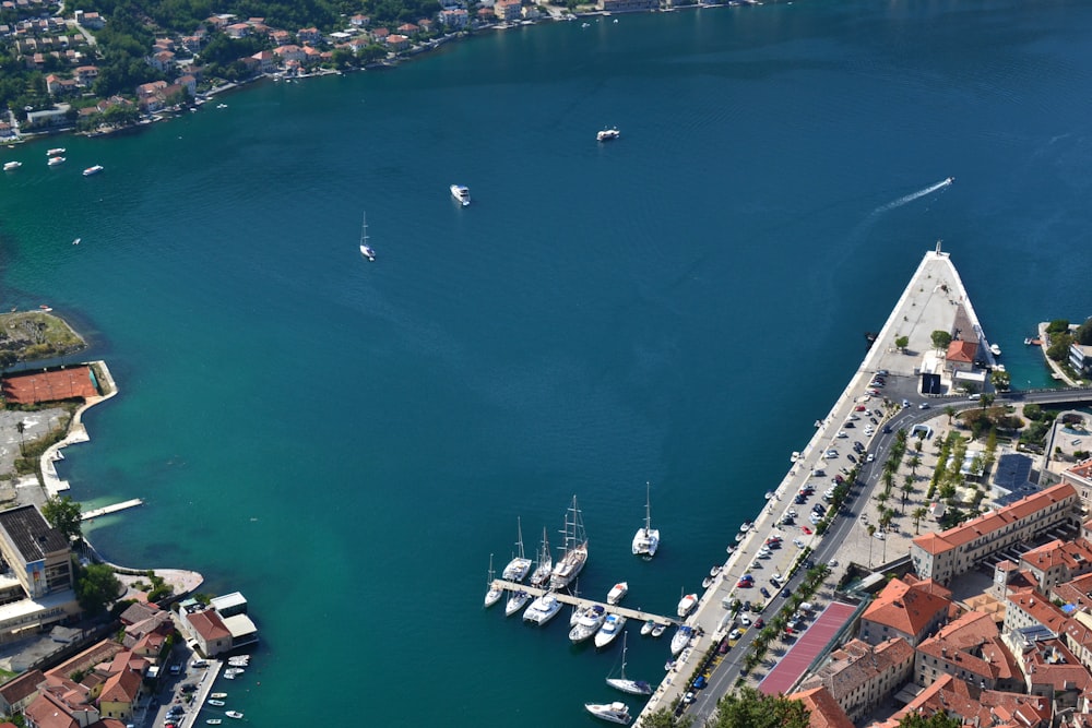 an aerial view of a harbor with boats in the water