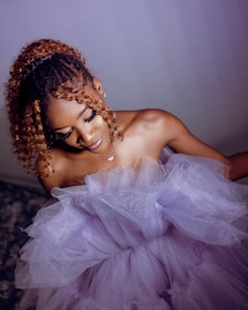 Elegant styled hair showcasing shiny curls under soft lighting.