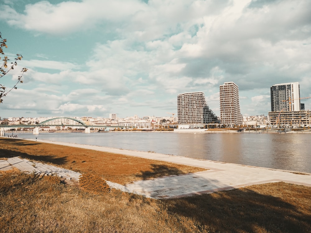 a body of water with a city in the background