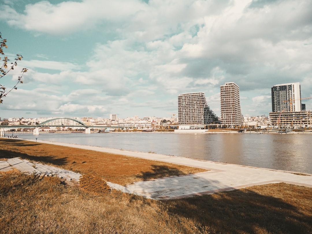 a body of water with a city in the background,