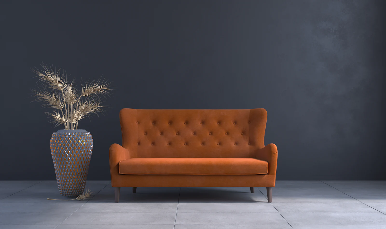 A low sofa in a warm coloured living room with a vase beside it.