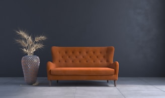 a living room with a couch and a vase