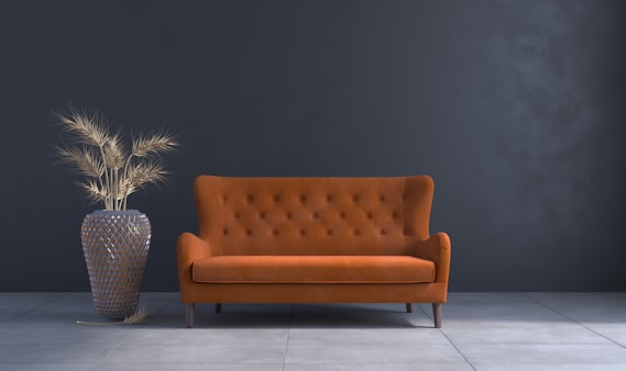 a living room with a couch and a vase