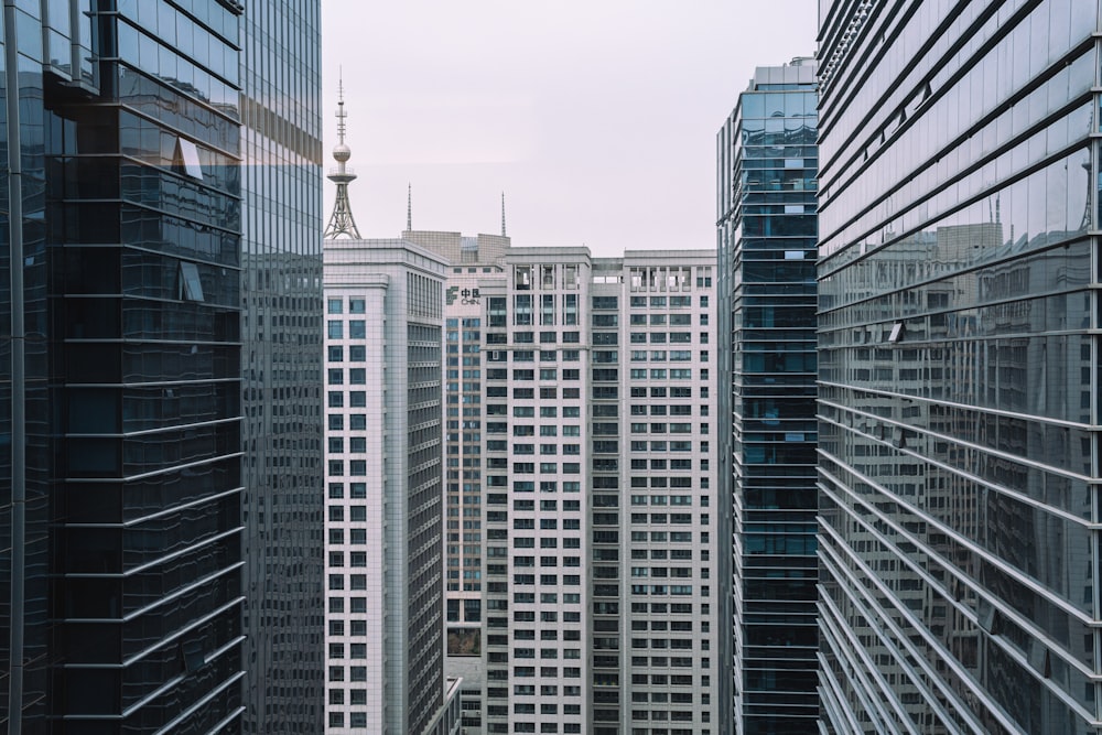 a city filled with tall buildings next to each other