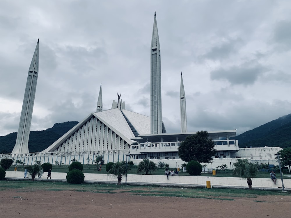 a large white building with two spires on top of it