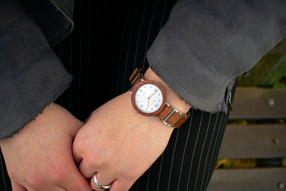 a person wearing a watch on their wrist