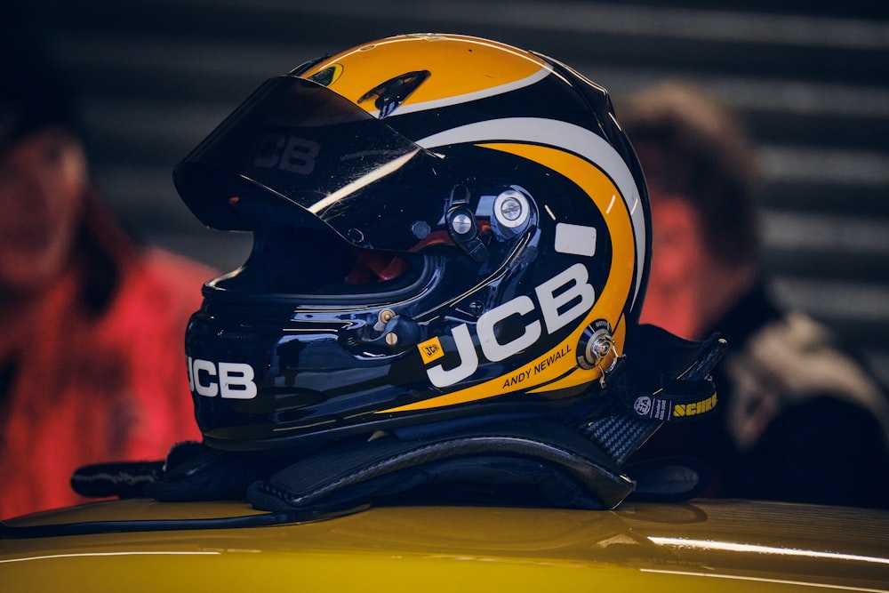 a helmet sits on top of a yellow car