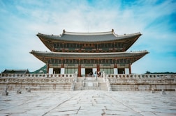 a tall building with a sky background