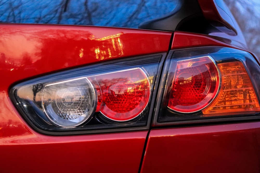 a close up of a red car's tail lights