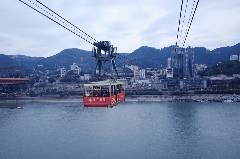 a cable car going over a body of water