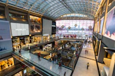 a mall filled with lots of people walking around