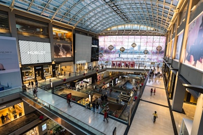 a mall filled with lots of people walking around